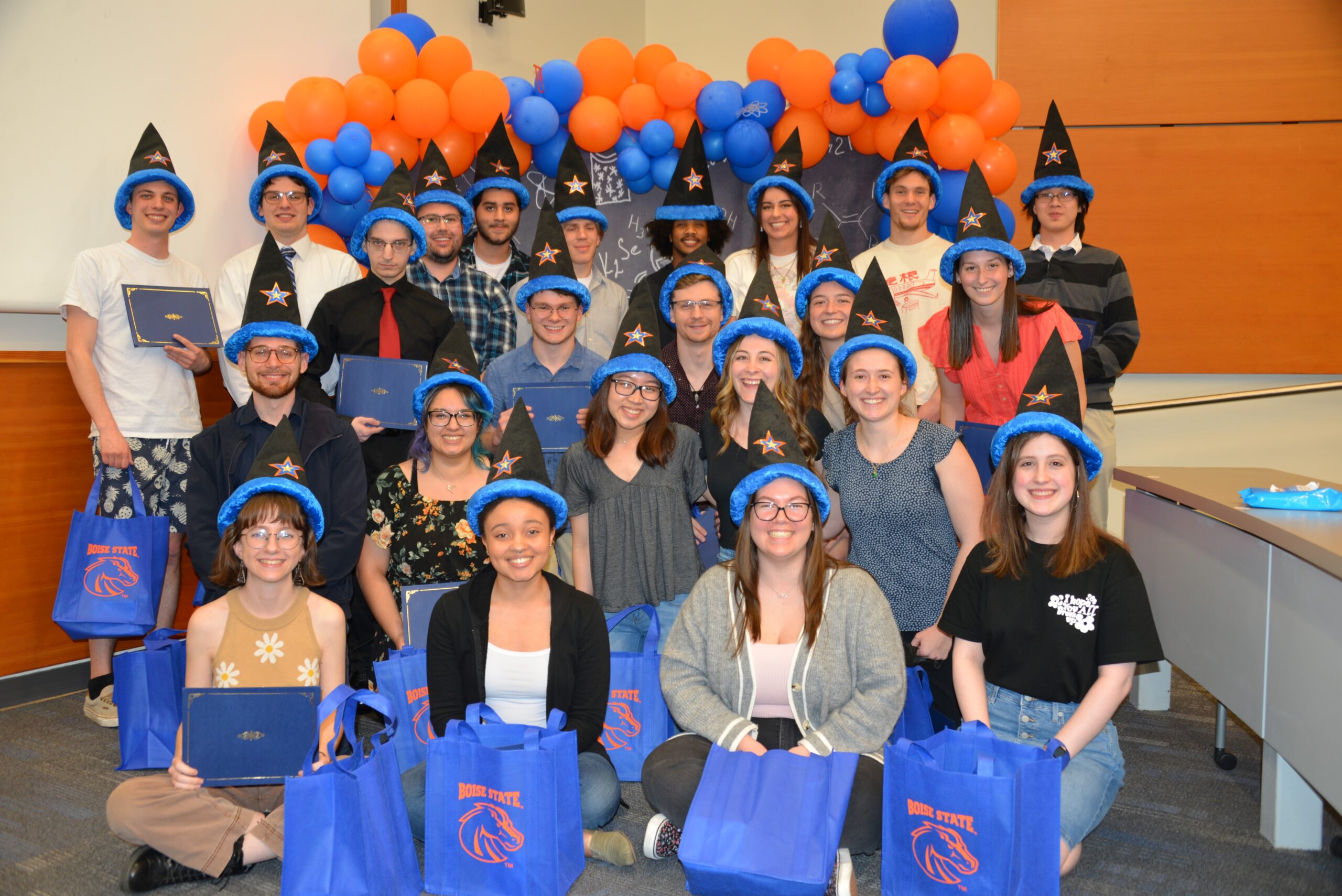 Group photo of the 2023 Graduates of the Department of Chemistry and Biochemistry wearing their Wizard Hats
