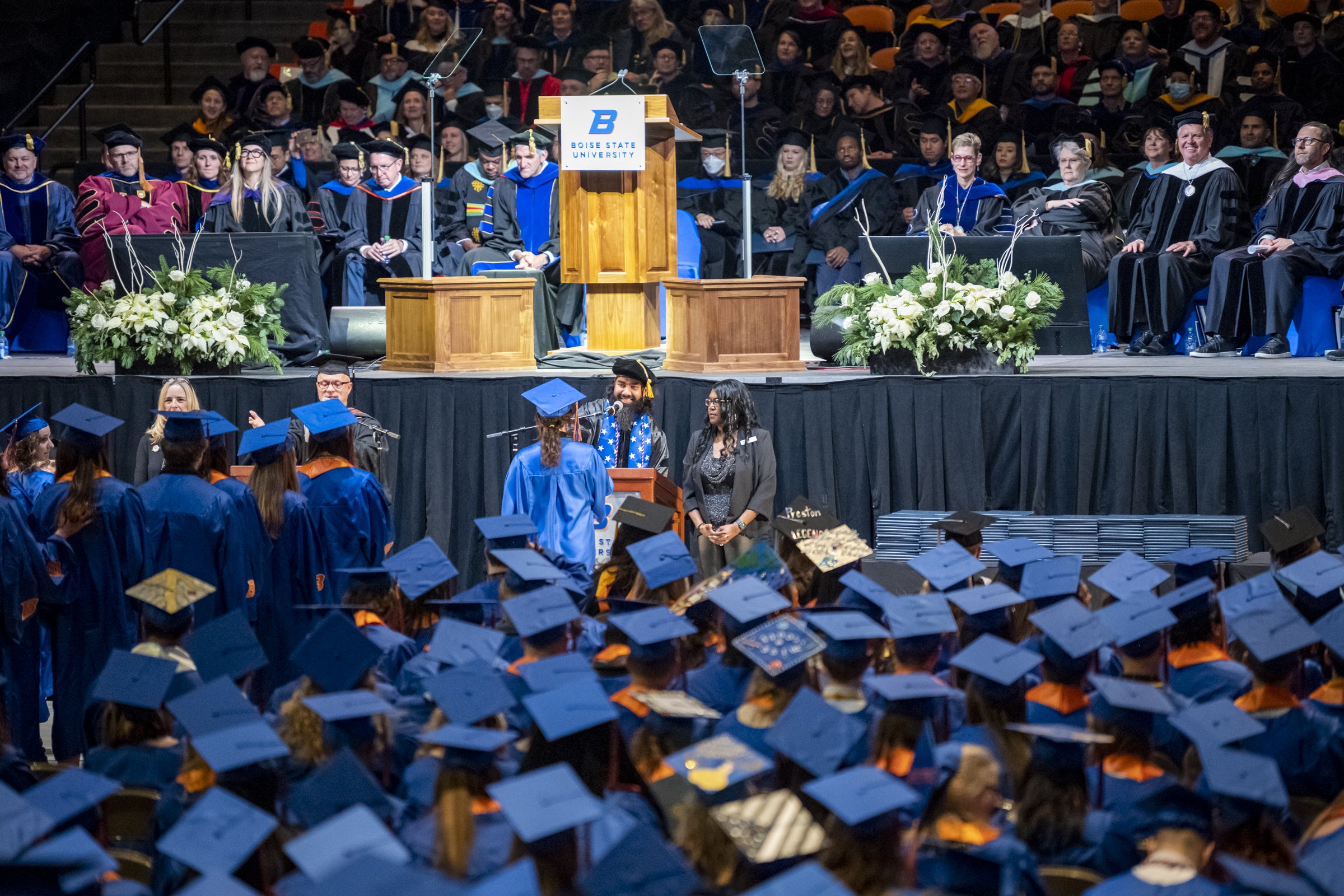 Students at commencement receiving their diplomas